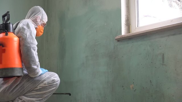 Coronavirus pandemic - Cleaning and Disinfection. Professional teams for disinfection efforts. Infection prevention and control of epidemic. Protective suit and mask