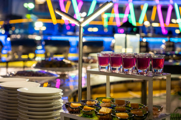 Desserts on the food shelf in the buffet item at night