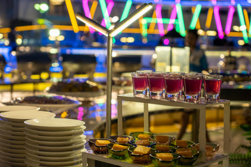 Desserts on the food shelf in the buffet item at night