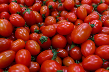 in the store counter or display case with red tomatoes