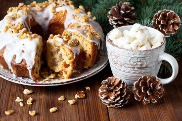 Traditional raisins cake for christmas  and mug with marshmallow