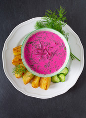 cold borsch with potatoes and dill, top view