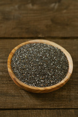  Chia seeds on a wooden surface
