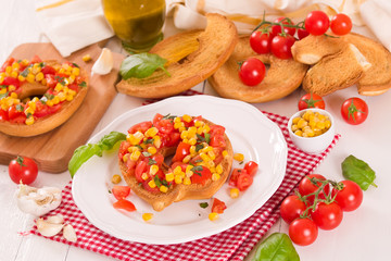 Friselle with tomatoes and mais.