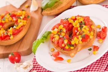 Friselle with tomatoes and mais.