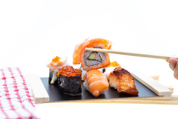 Sushi, Sashimi with chopsticks, Japanese sushi with soy sauce and wasabi.