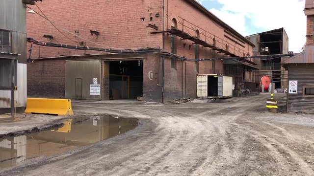 Panning up over old mining buildings