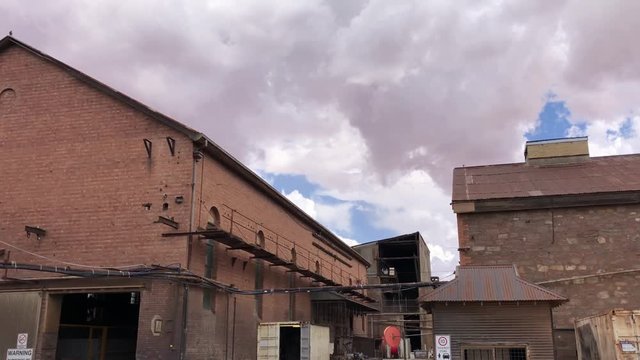 Old buildings under stormy skies