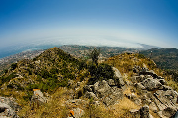 Big mountains, blue sky and green trees