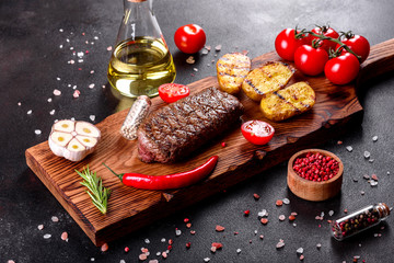 Ribeye steak with potatoes, onions and cherry tomatoes