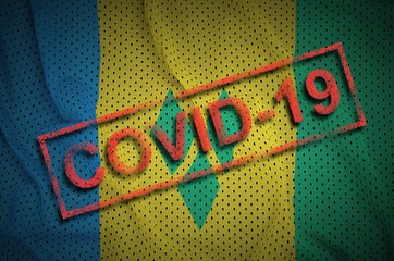 Saint Vincent and the Grenadines flag and red Covid-19 stamp. Coronavirus 2019-nCov outbreak