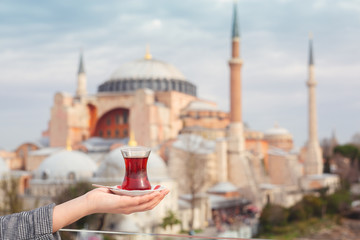 A glass of Turkish tea on the background of Hagia Sophia