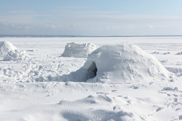 Igloo  standing on a snowy  reservoir in the winter, Novosibirsk, Russia