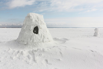 Igloo  standing on a snowy  reservoir in the winter, Novosibirsk, Russia