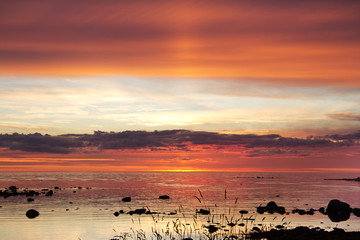 Red sunset on the Arctic Ocean in dark tone