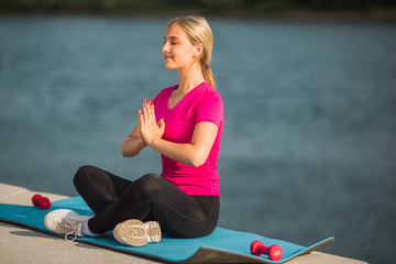 beautiful young woman in sportswear in summer