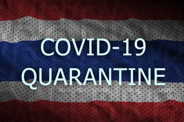 Thailand flag and Covid-19 quarantine inscription. Coronavirus or 2019-nCov virus