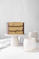 Cross section of an irish whiskey cake with irish cream and a chocolate ganache filling, view of inside a cake, st patrick's day  cake on a white cake stand