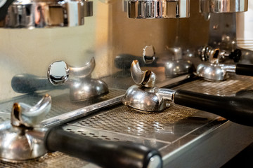 Details of an industrial coffee maker of a coffee shop