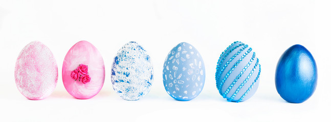 Easter eggs collection. Chicken eggs painted blue or pink isolated on a white background. Creative card with Easter. Banner. Copy space.