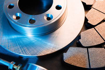 brake parts on dark background  brake pads, disc, brake hose, guides, cylinders - Image