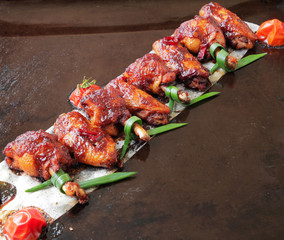  baked chicken wings with spices, tomato and soy sauce