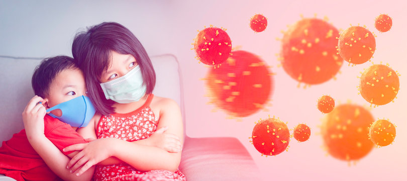 Coronavirus or Covid-19 concept.Sibling Little chinese sister and brother wearing mask for stop corona virus outbreak at home.Quarantine asian sibling.Covid-19 coronavirus and epidemic virus symptoms.