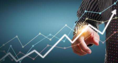 Hand touching  graphs of financial indicator and accounting market economy analysis chart