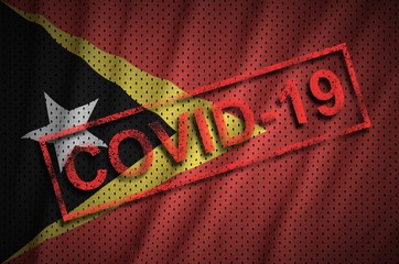 Timor Leste flag and red Covid-19 stamp. Coronavirus 2019-nCov outbreak