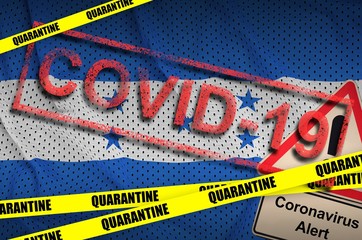 Honduras flag and Covid-19 quarantine yellow tape with red stamp. Coronavirus or 2019-nCov virus