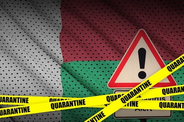 Madagascar flag and Covid-19 quarantine yellow tape. Coronavirus or 2019-nCov virus