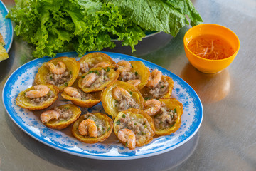 Plate of Vietnamese fried shrimp pancakes- Banh Khot