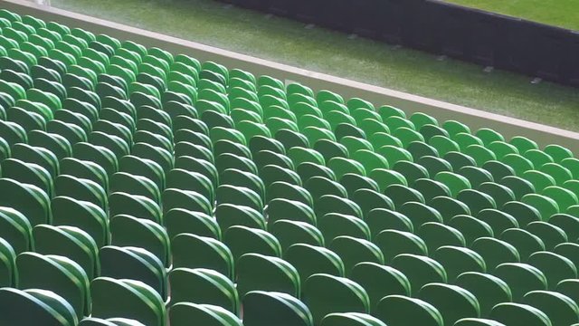 Empty plastic seats in a stadium. Matches to be played without fans.