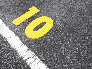 number 10 on parking lot.paint on the road.
