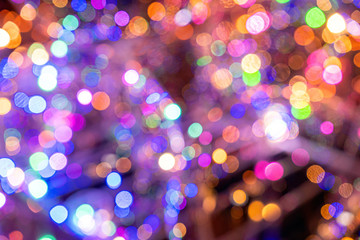 Christmas background. Festive elegant abstract background with colorful bokeh lights and stars