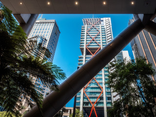 Looking at the nearby high rise landmark buildings through the structural bracing truss at the low...