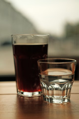 Stylish served specialty alternative black coffee. Filter pour-over coffee served in crystal glass and decanter. Aesthetics coffee
