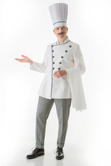 Elegant chef cook posing on a white background 