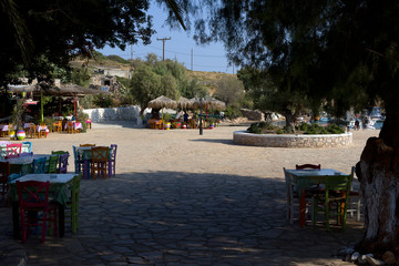Arkoi island, restaurants surrounding the small harbor, early in the morning, Dodecanese Islands, Greece
