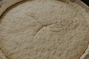 Fresh dough on the table.