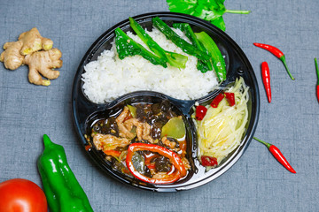 Dishes made from fungus and sliced ​​meat.  Chinese food.  Fungus meat slices.  A rice and dish set.  Takeaway