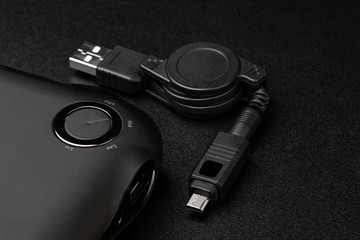 Powerbank for charging mobile devices on black background