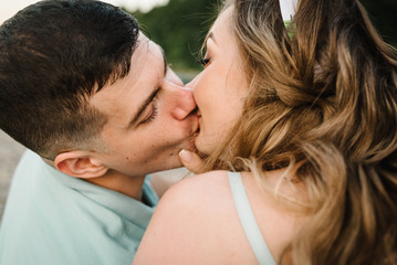 Fototapeta premium Loving couple kissing in nature. Kiss. Love. Close up.