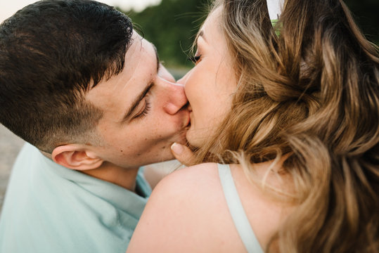 Loving couple kissing in nature. Kiss. Love. Close up.