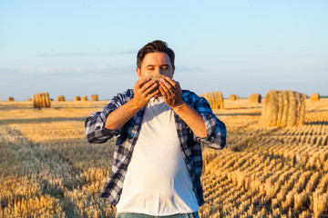 successful agriculturist in field of wheat. harvest time