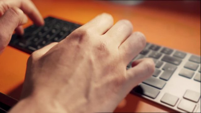 Hands touch typing on computer keyboard