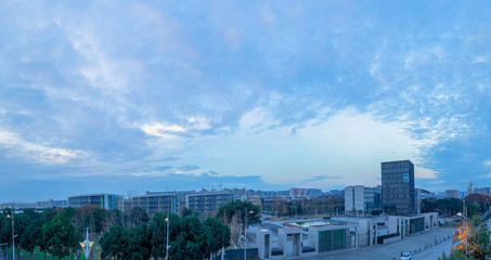 City scenery under the setting sun.  The sky after sunset in the evening was covered with clouds.  The city's architectural streets and sky perfectly match