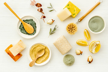 Set of homemade cosmetics ingredients with cosmetic clay. Spa treatments, aroma theme. White deck, top view