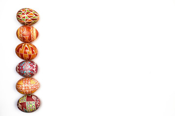 A row of colorful, floral easter eggs isolated on a white background. place for text