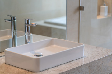 Modern faucet and white ceramic washbasin sink bathroom interior building decoration